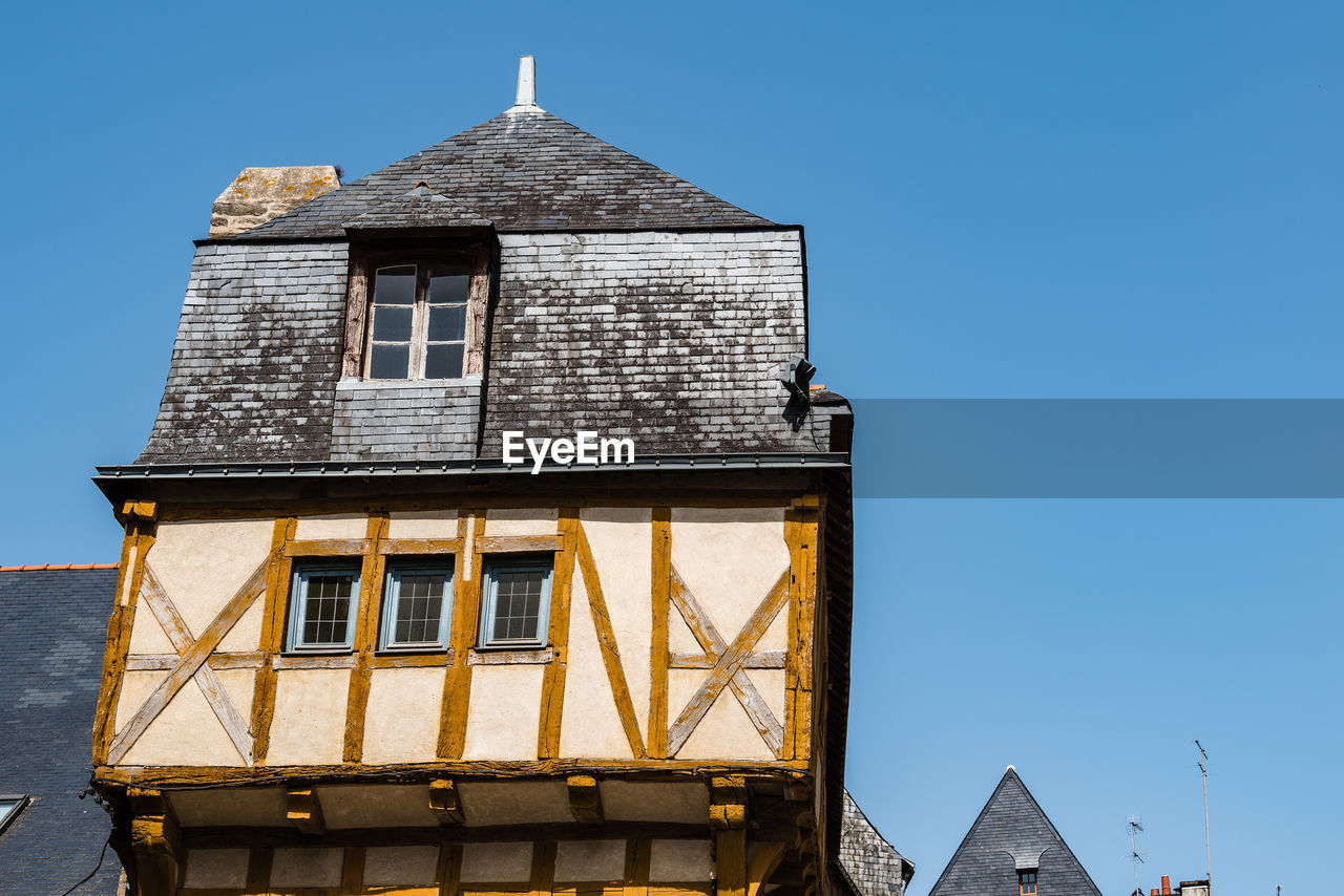 Low angle view of colorful timber-framed medieval house in historic centre of vannes, brittany