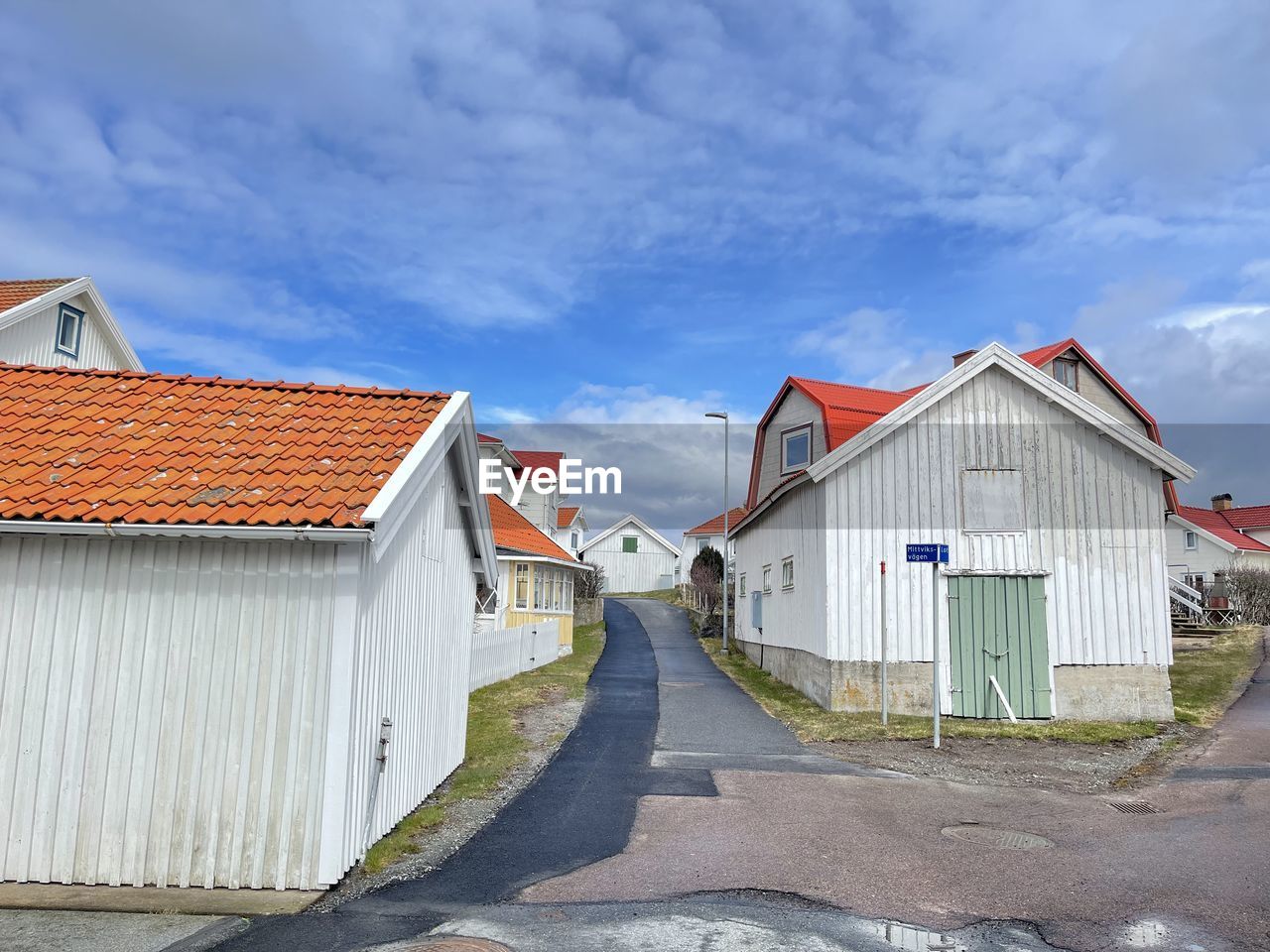 A view of red wooden houses on vrango archipelago island .