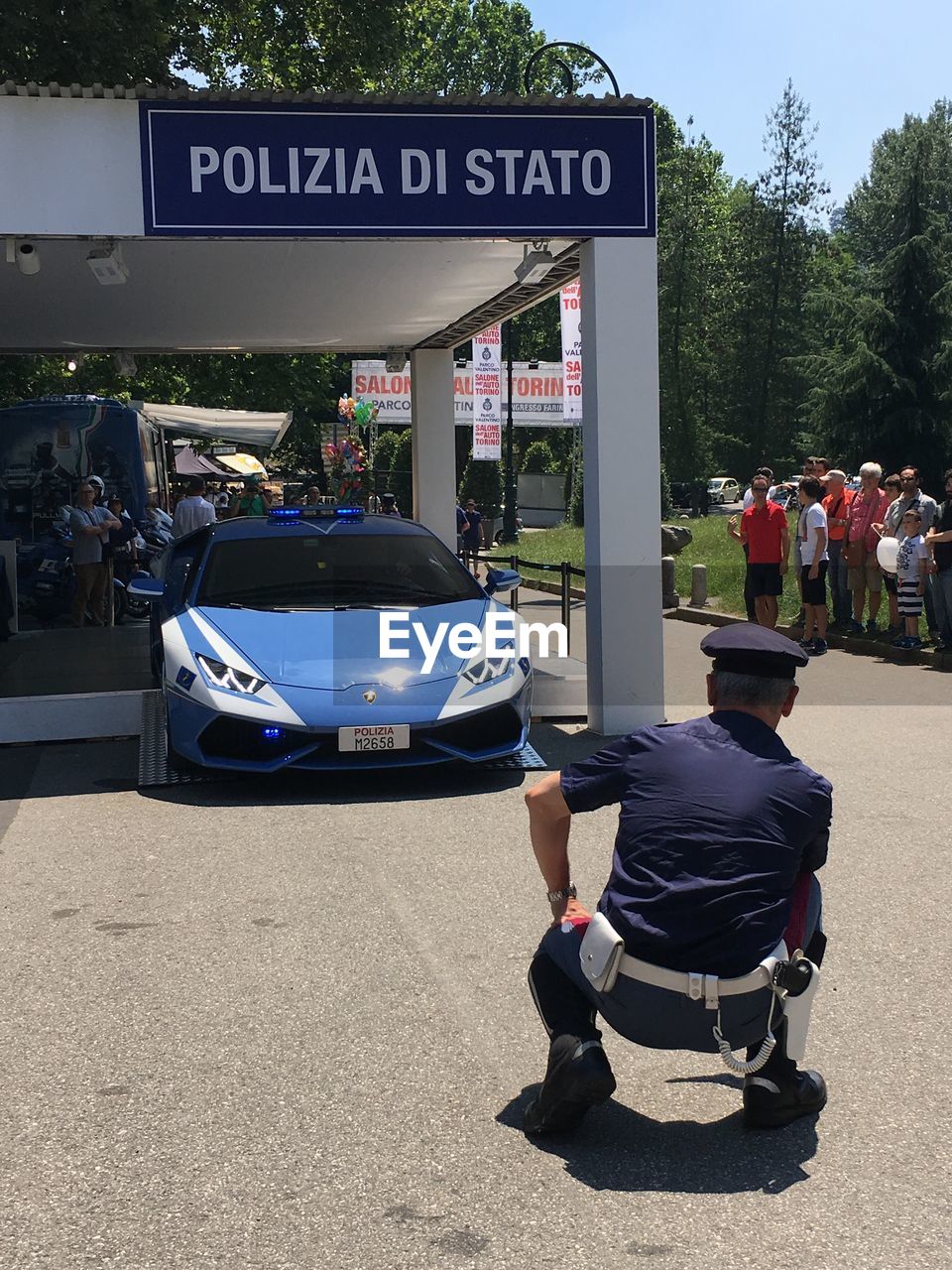 REAR VIEW OF MAN IN CAR