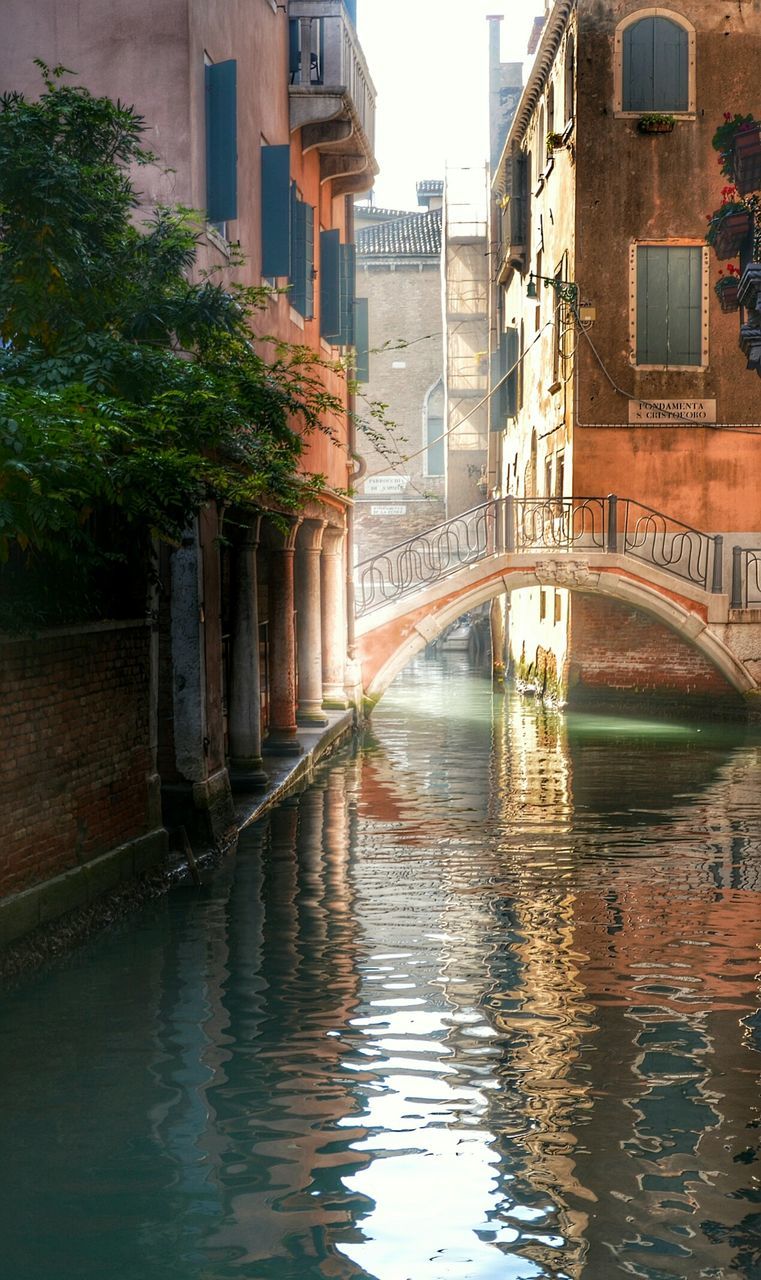 Arch bridge over canal in city