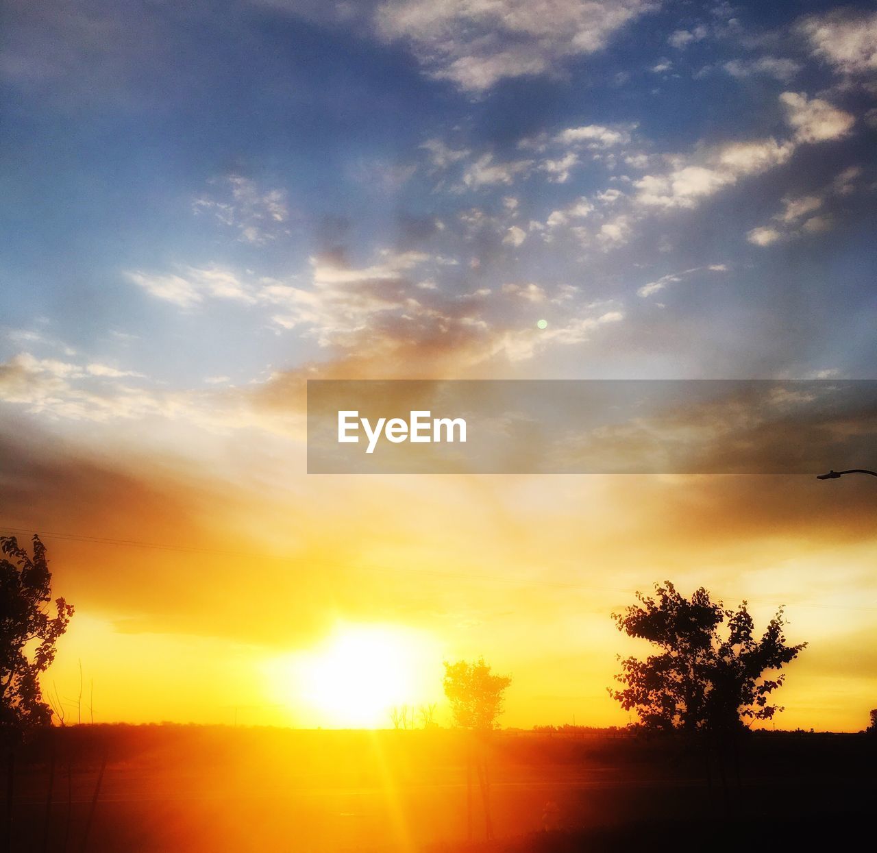 SUNSET OVER LANDSCAPE