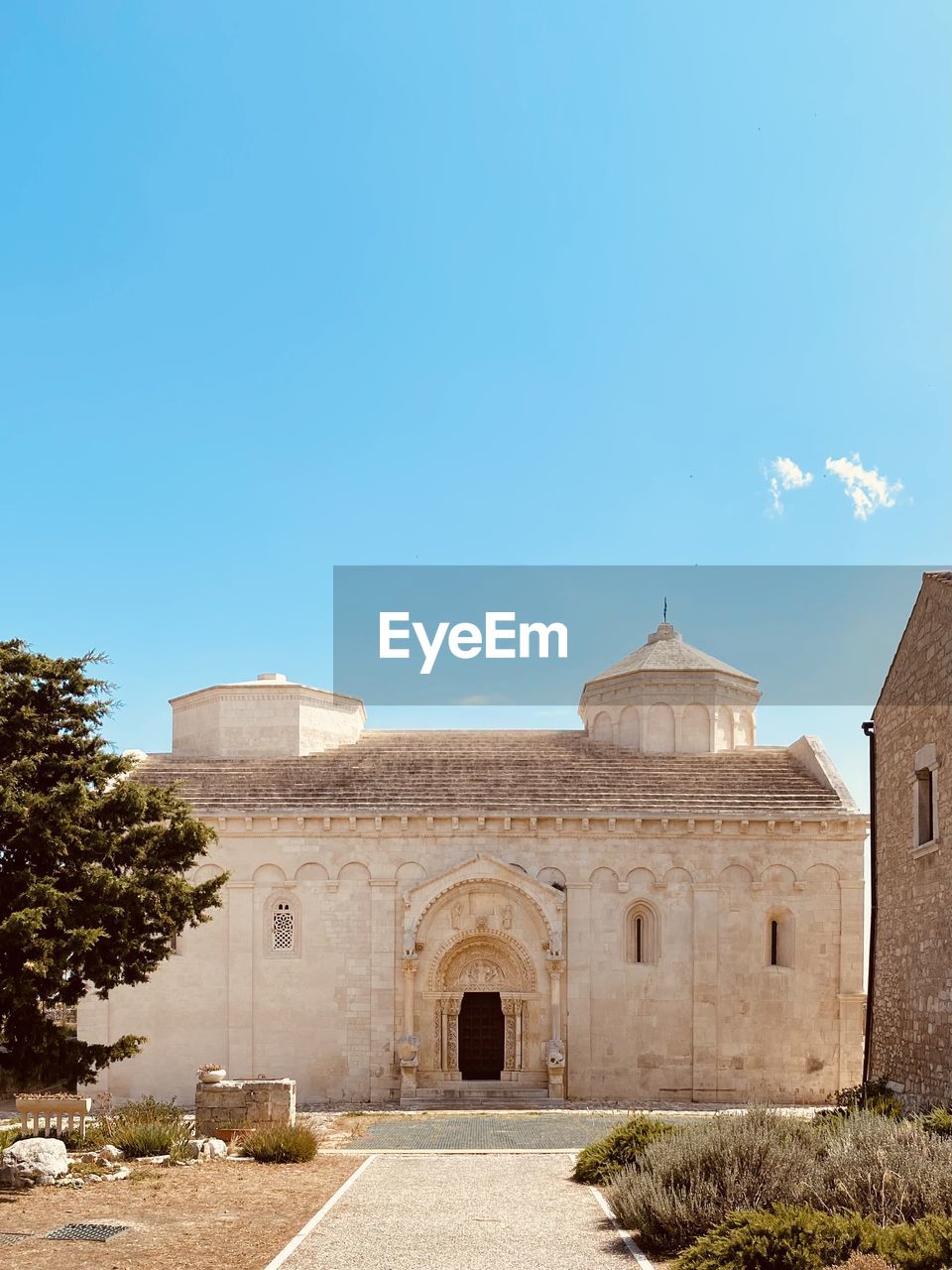 Low angle view of historic building against clear blue sky