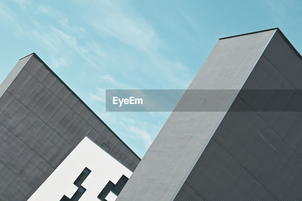 architecture, built structure, building exterior, sky, city, facade, building, skyscraper, blue, business, low angle view, office, office building exterior, no people, line, tower block, nature, day, outdoors, landmark, cloud, brutalist architecture, finance, glass