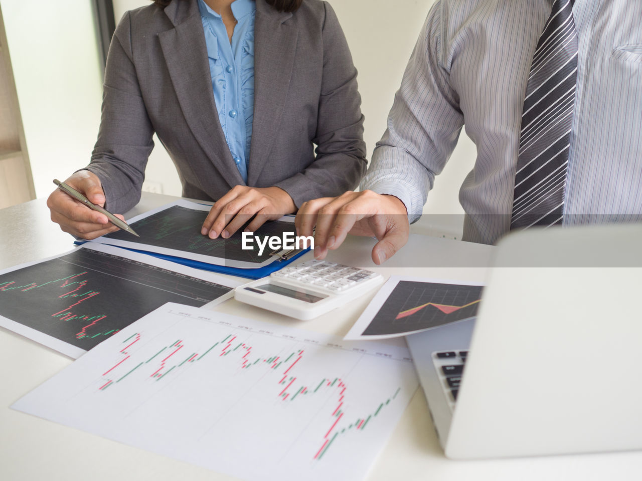 TWO PEOPLE WORKING IN OFFICE