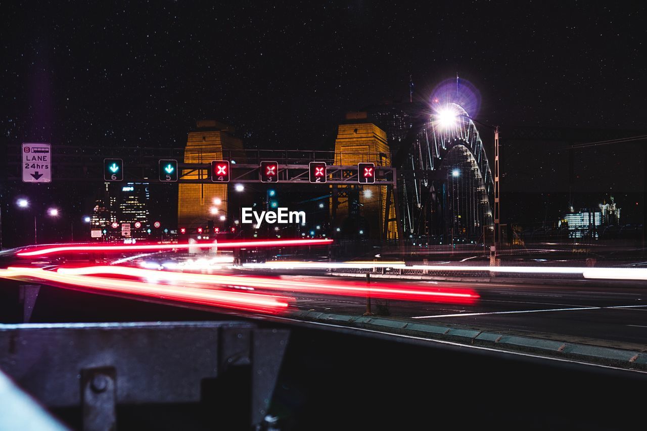 Illuminated light trails at sydney harbor bridge