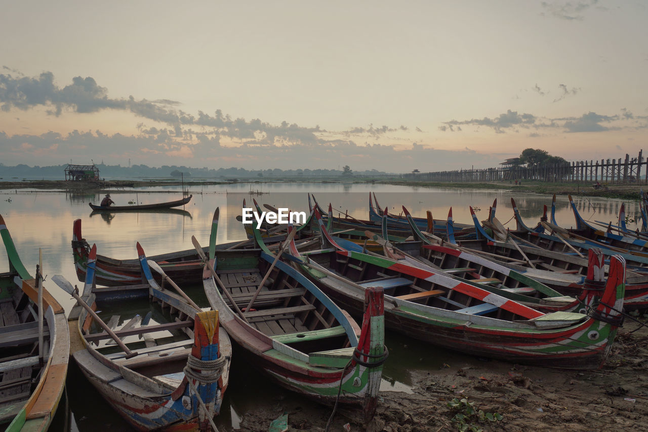BOATS MOORED AT SEASIDE
