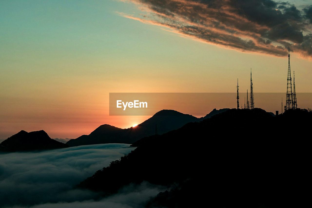 Silhouette mountains against sky during sunset