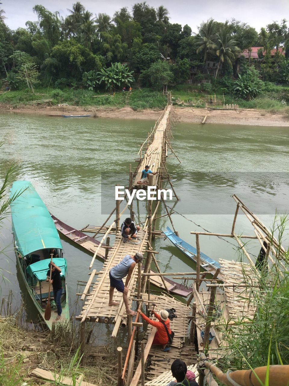 HIGH ANGLE VIEW OF NAUTICAL VESSEL MOORED ON RIVER