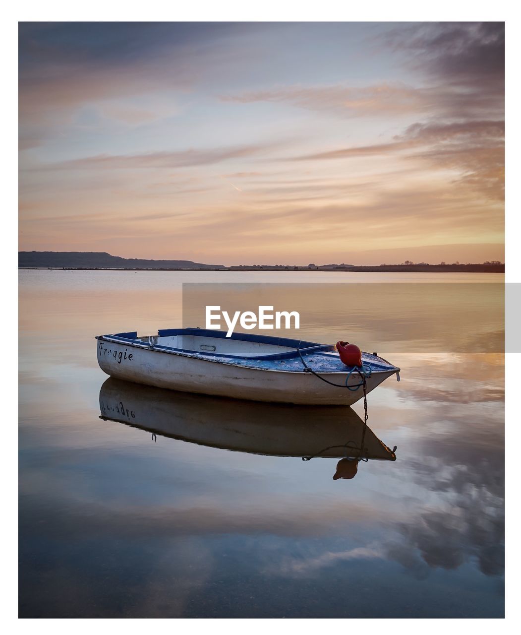 BOAT ON SEA AGAINST SKY