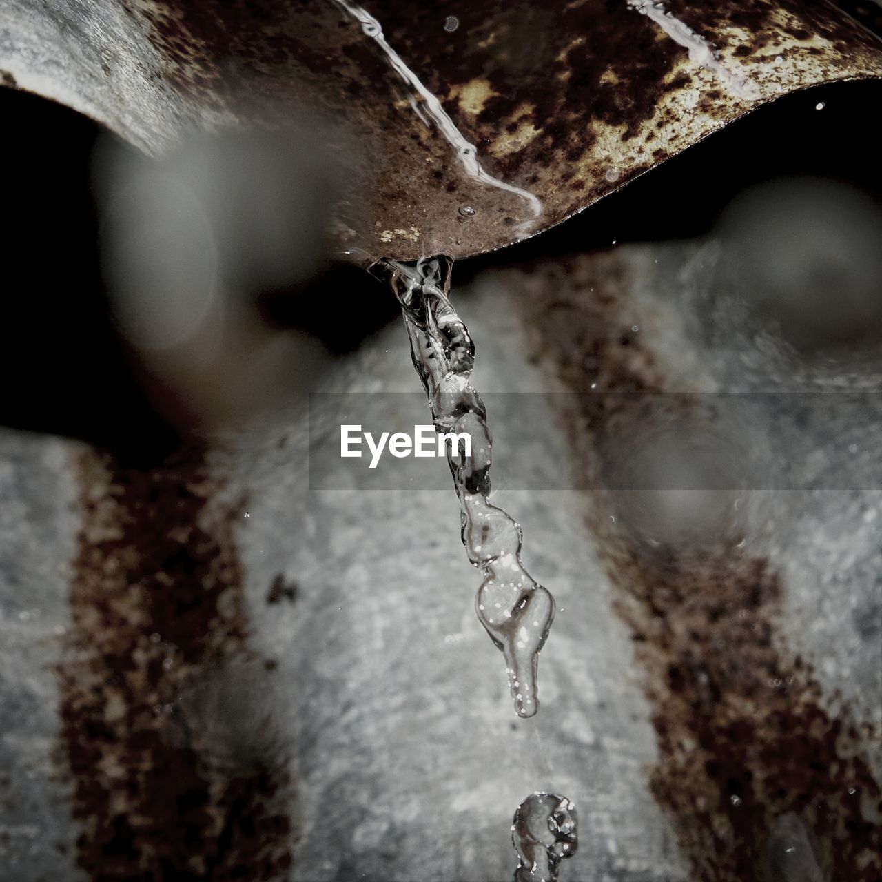 Detail shot of water falling from roof