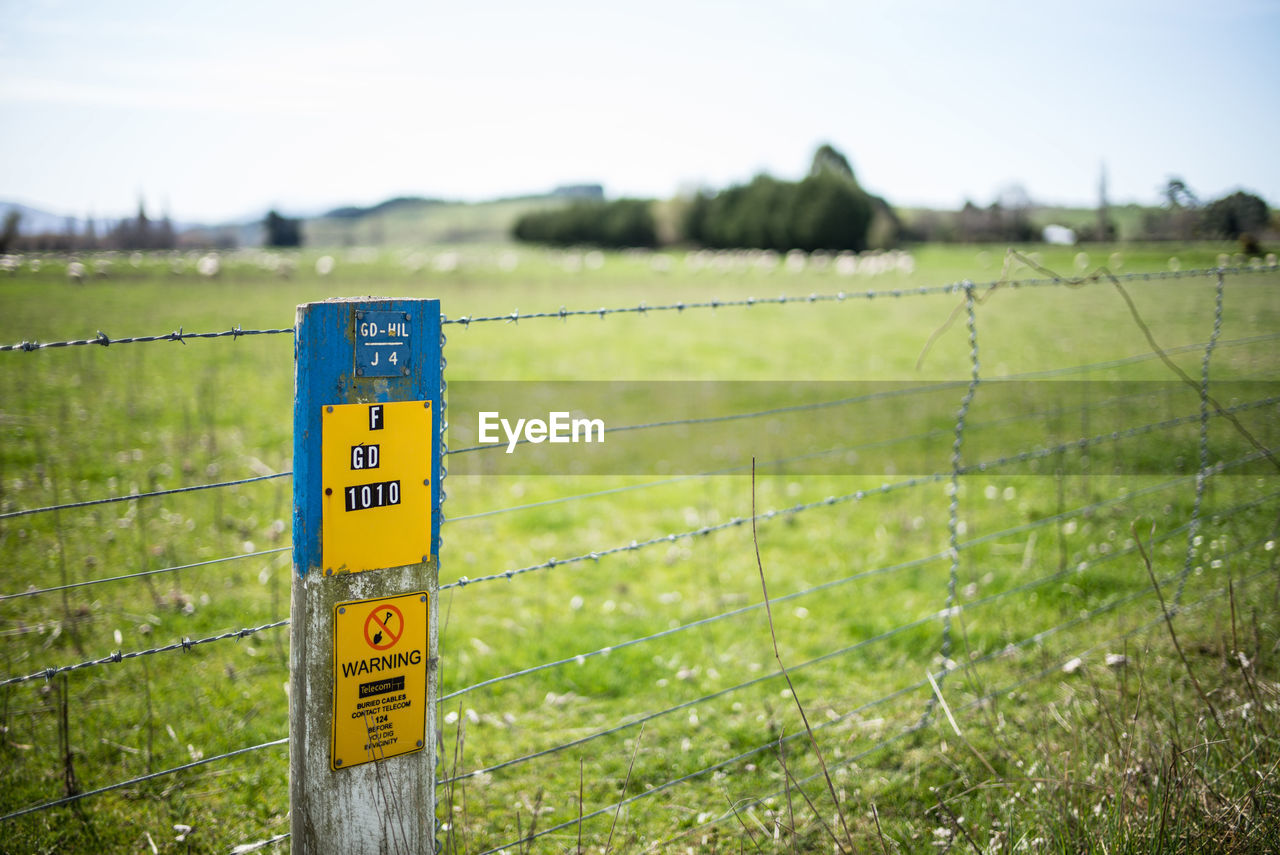 Information sign on grassy field