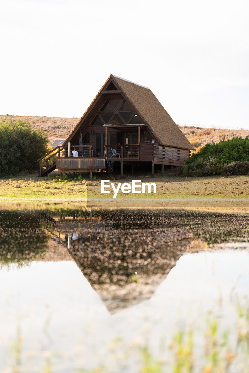 Scenic view of cabin against clear sky