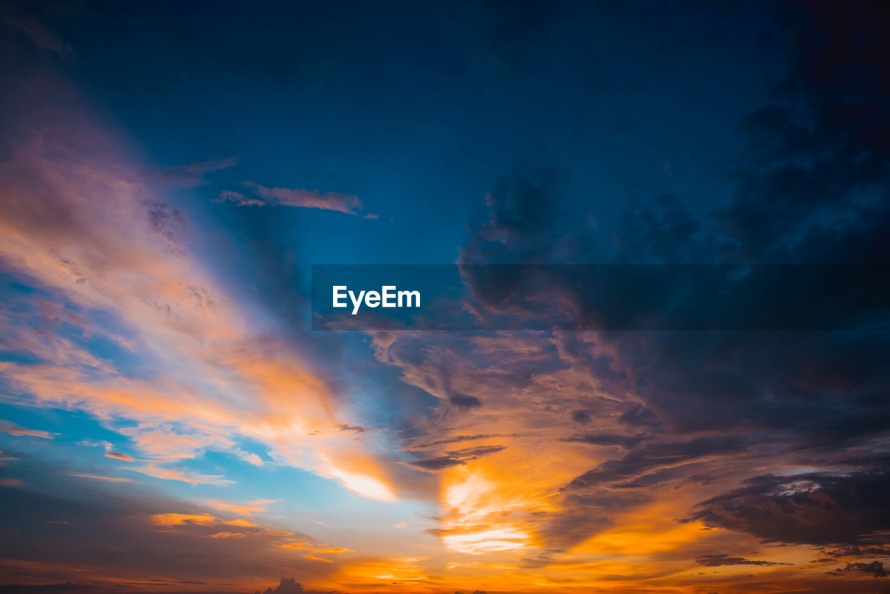 Low angle view of dramatic sky during sunset