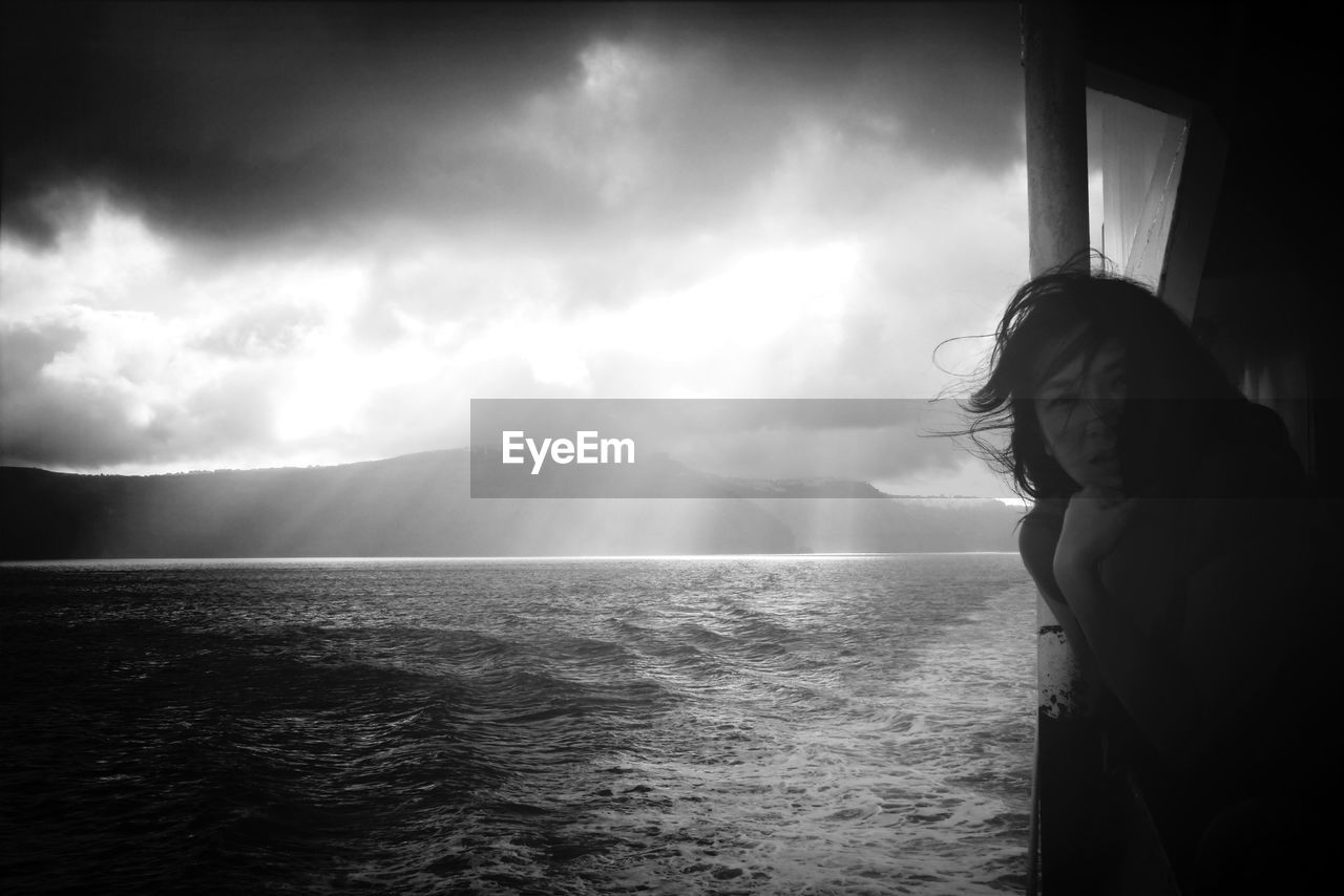 Portrait of young woman by the sea