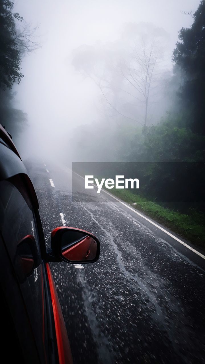 Car on road during rainy season