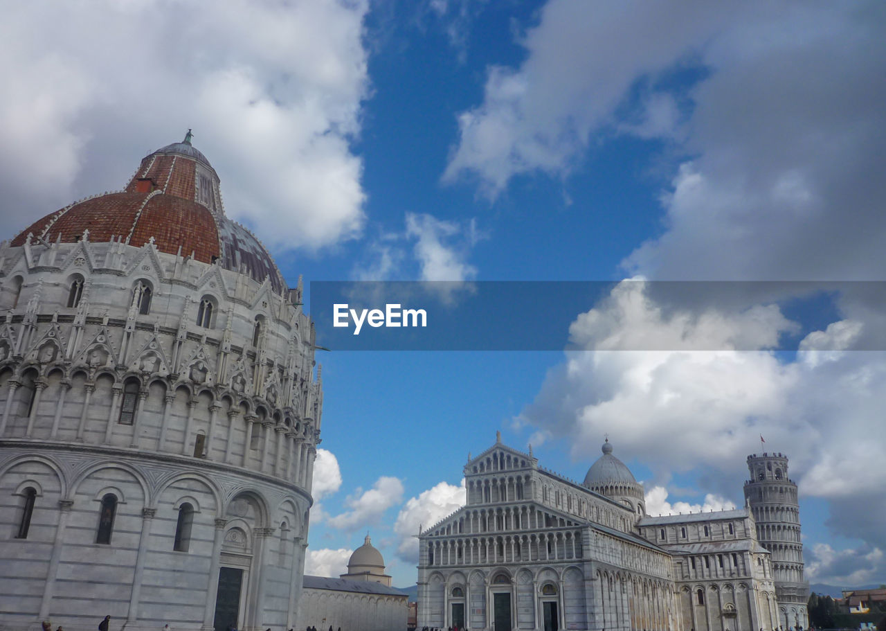 LOW ANGLE VIEW OF HISTORIC BUILDING AGAINST CLOUDY SKY