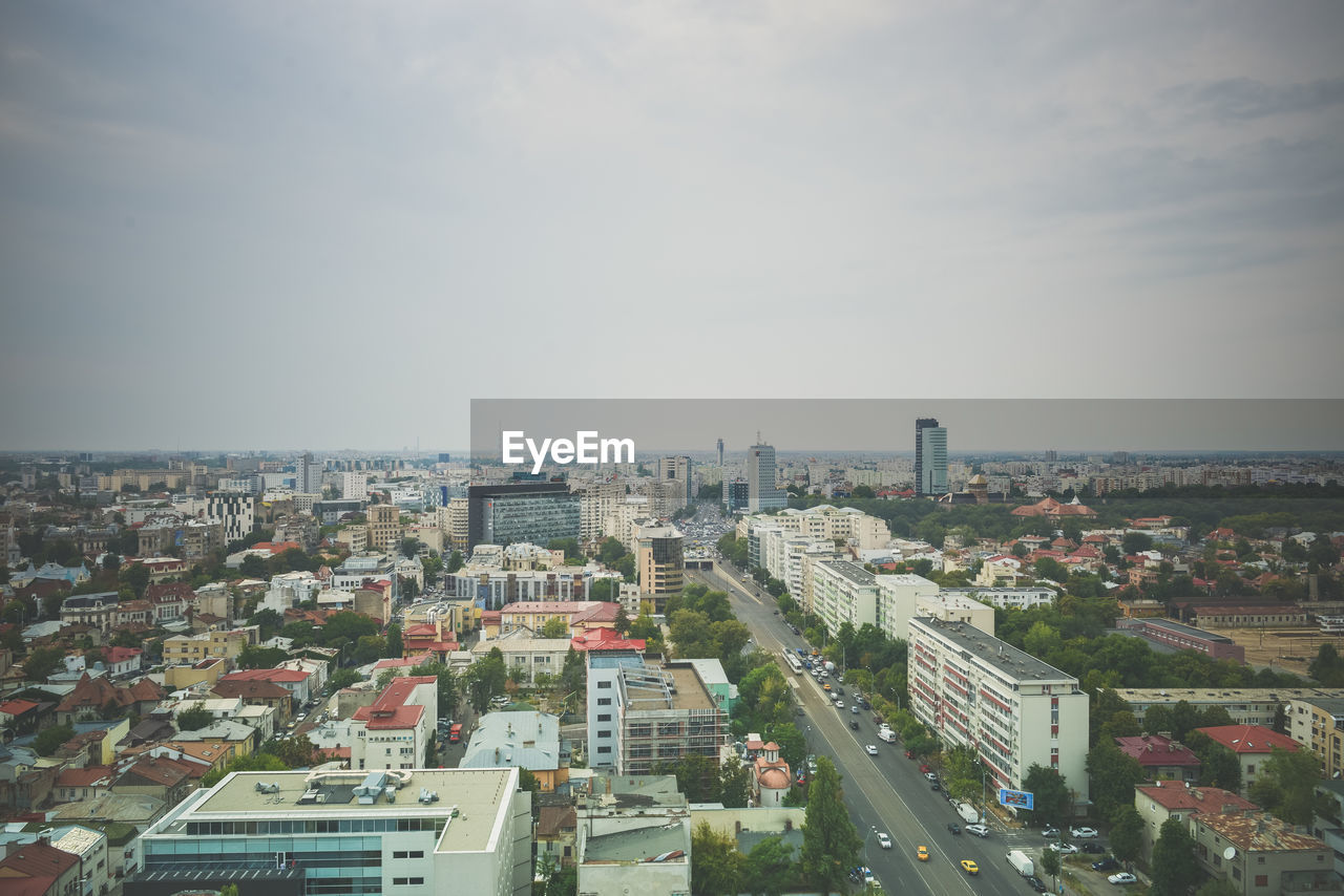 HIGH ANGLE VIEW OF BUILDINGS AGAINST SKY