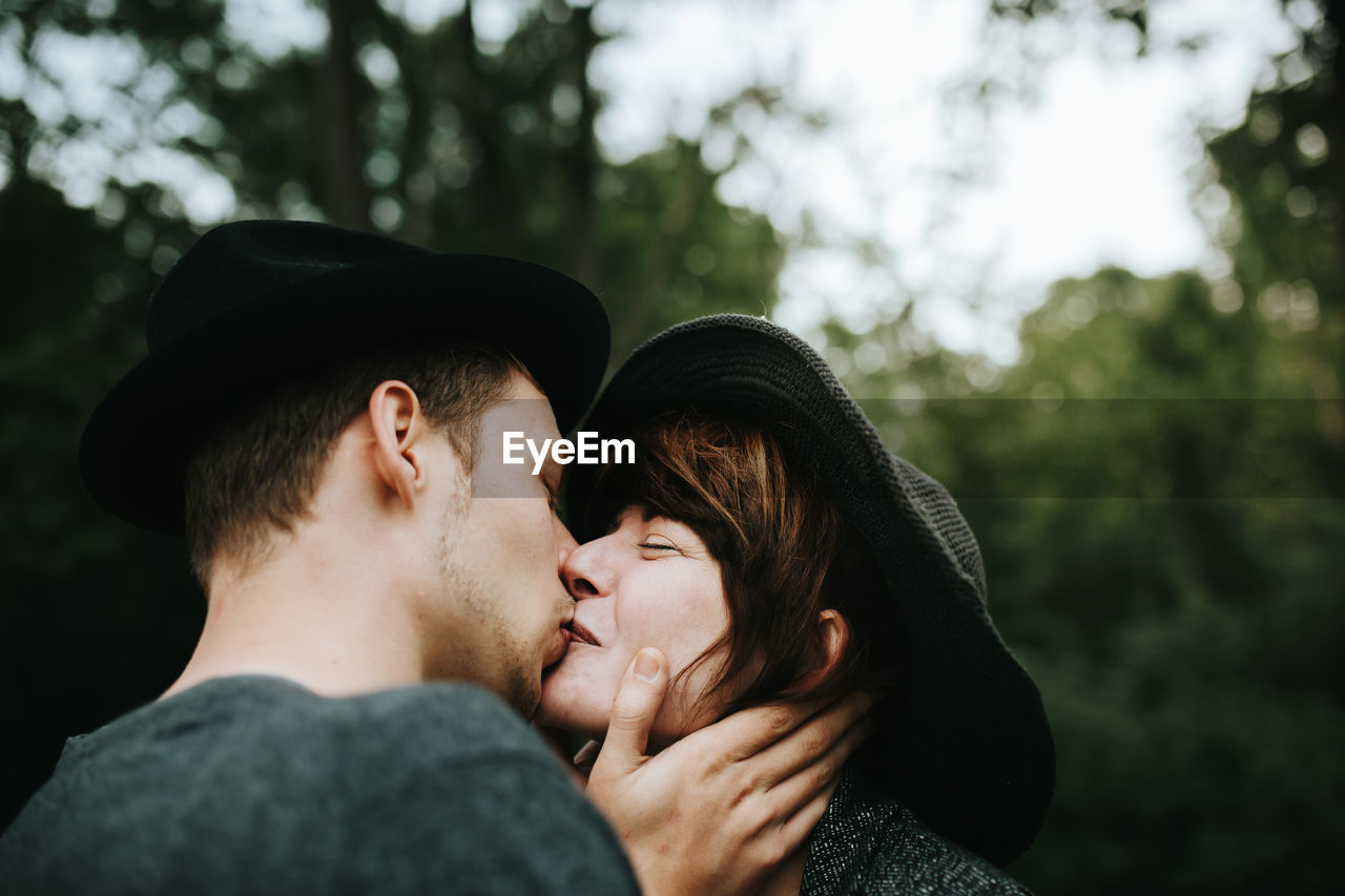 Couple kissing in park