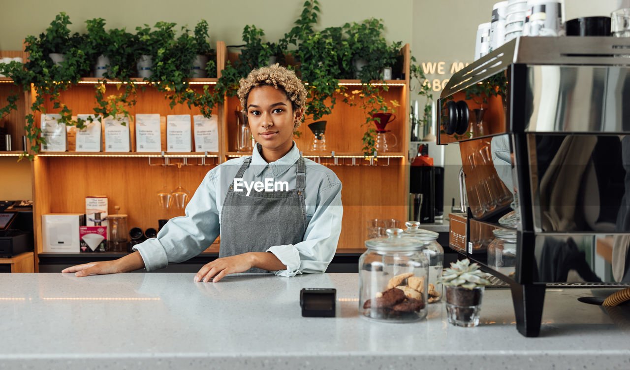 portrait of young woman sitting at table