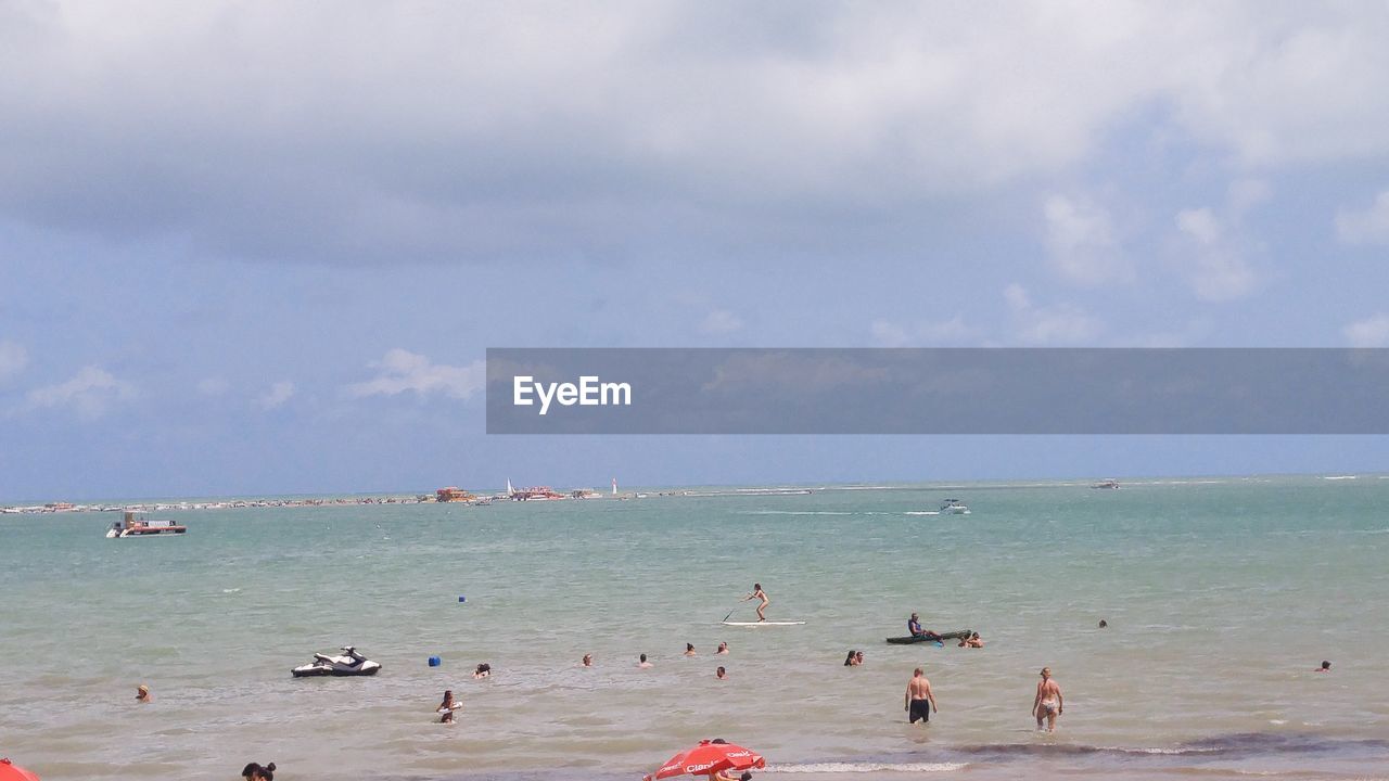 PANORAMIC VIEW OF PEOPLE ON BEACH