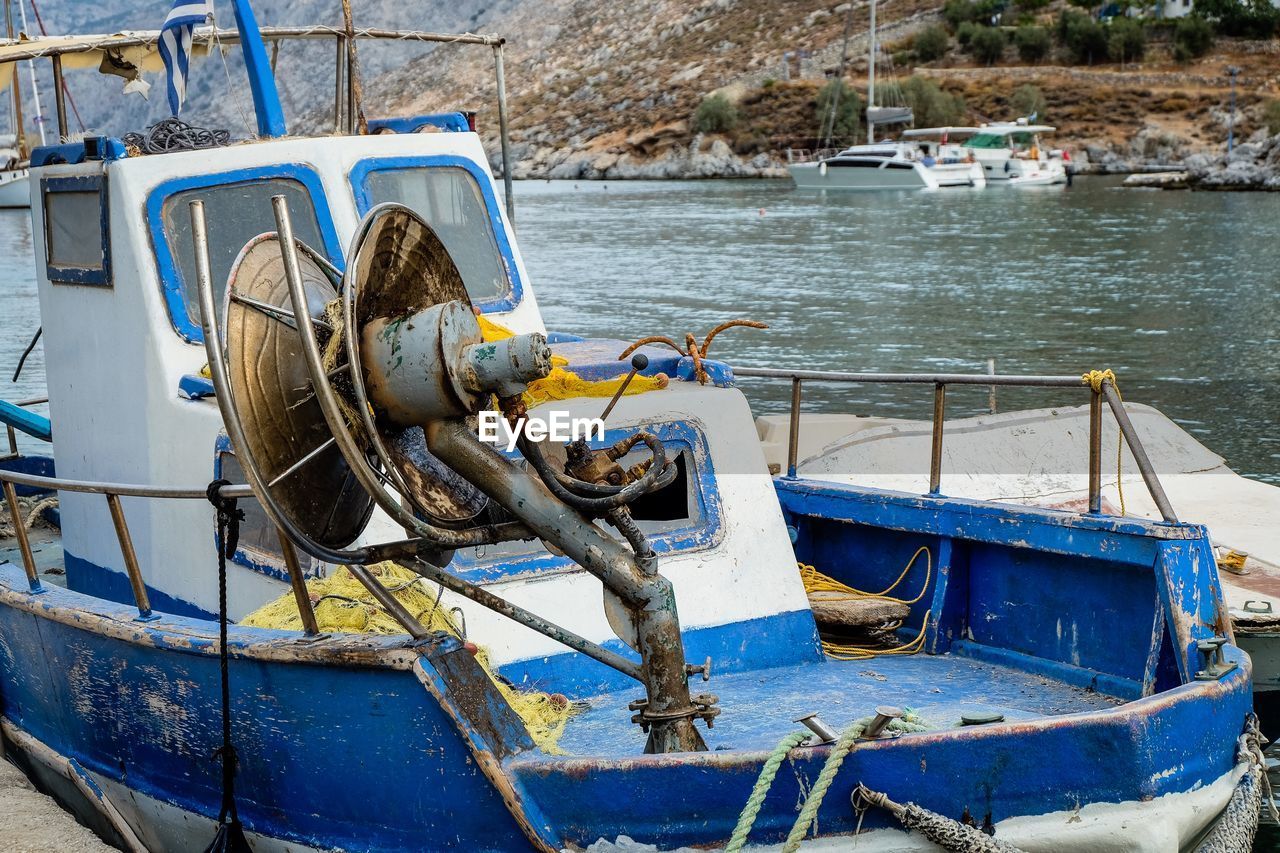 Fishing boat moored at harbor