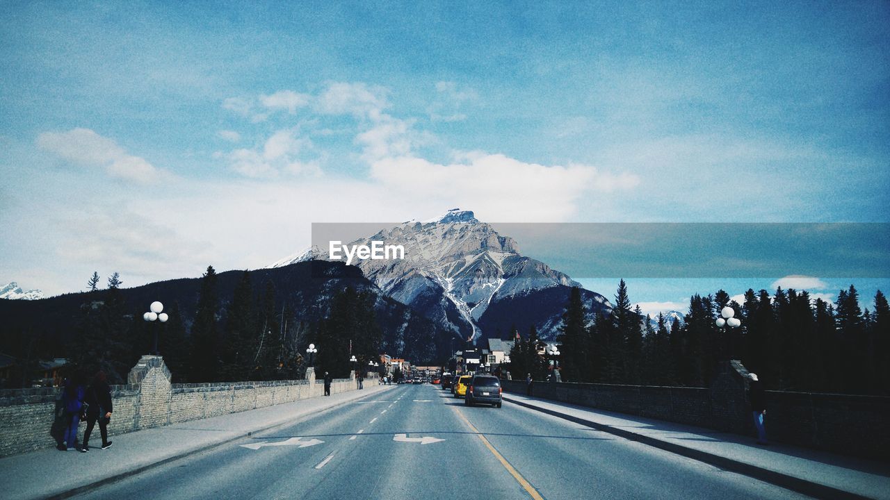 Road against snow covered mountains