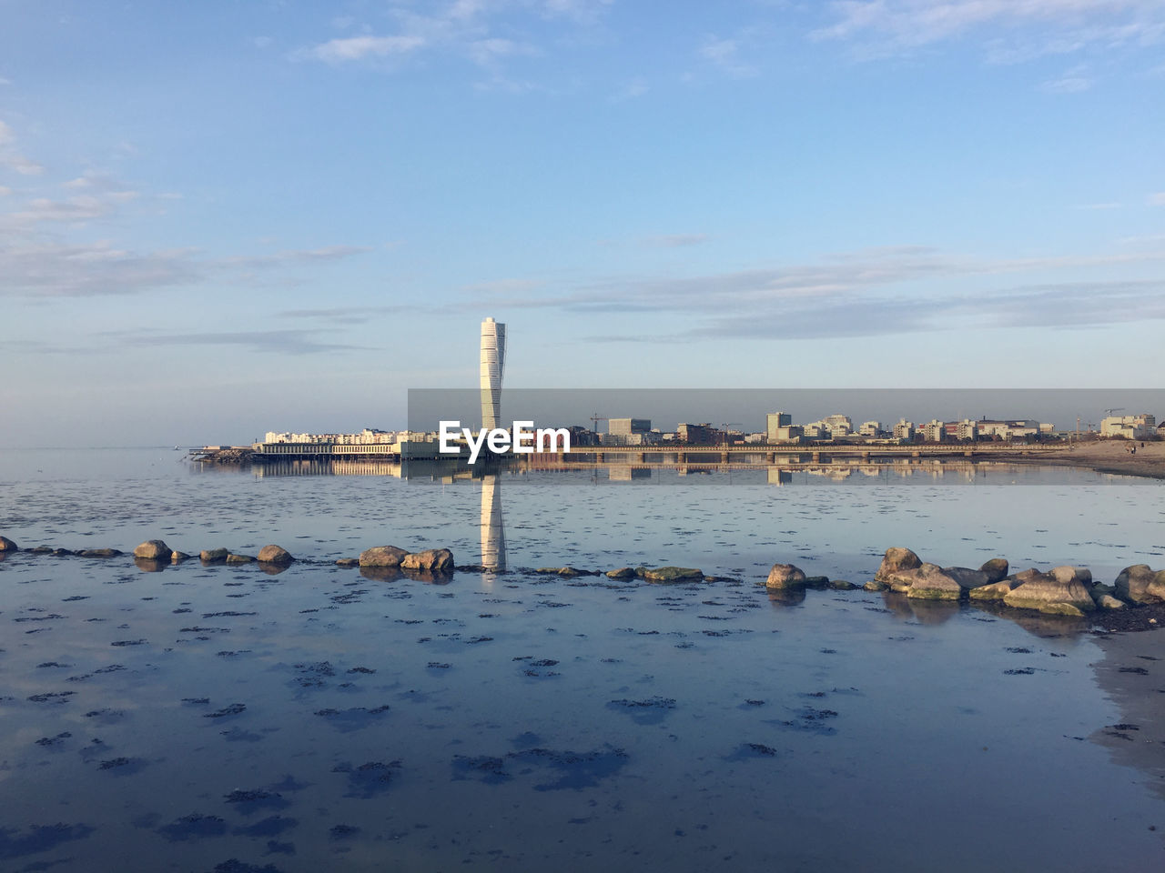 Calm waters beneath turning torso