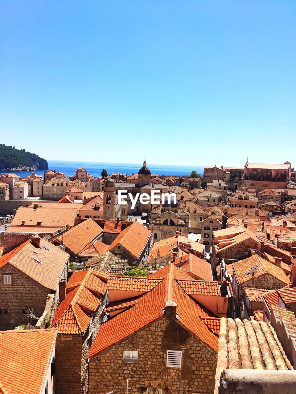 High angle view of cityscape against clear blue sky