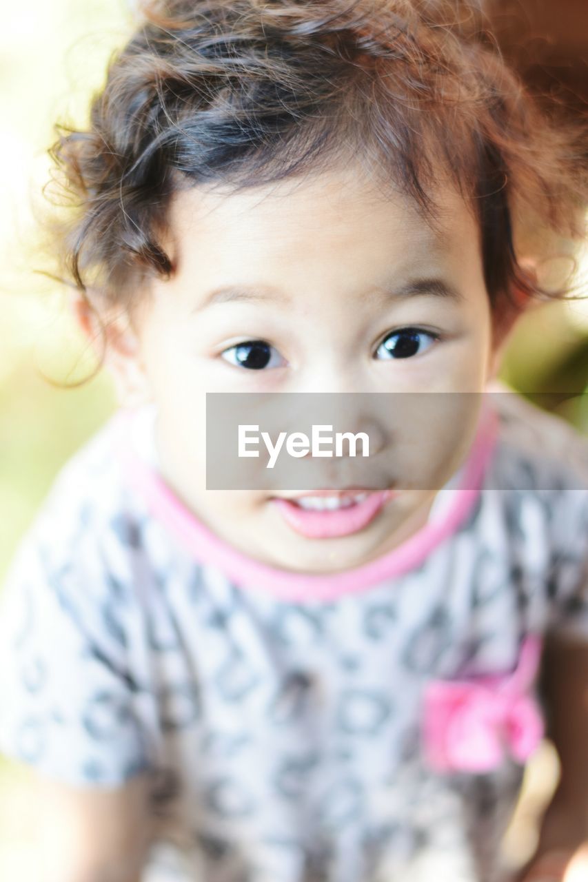 CLOSE-UP PORTRAIT OF CUTE SMILING GIRL