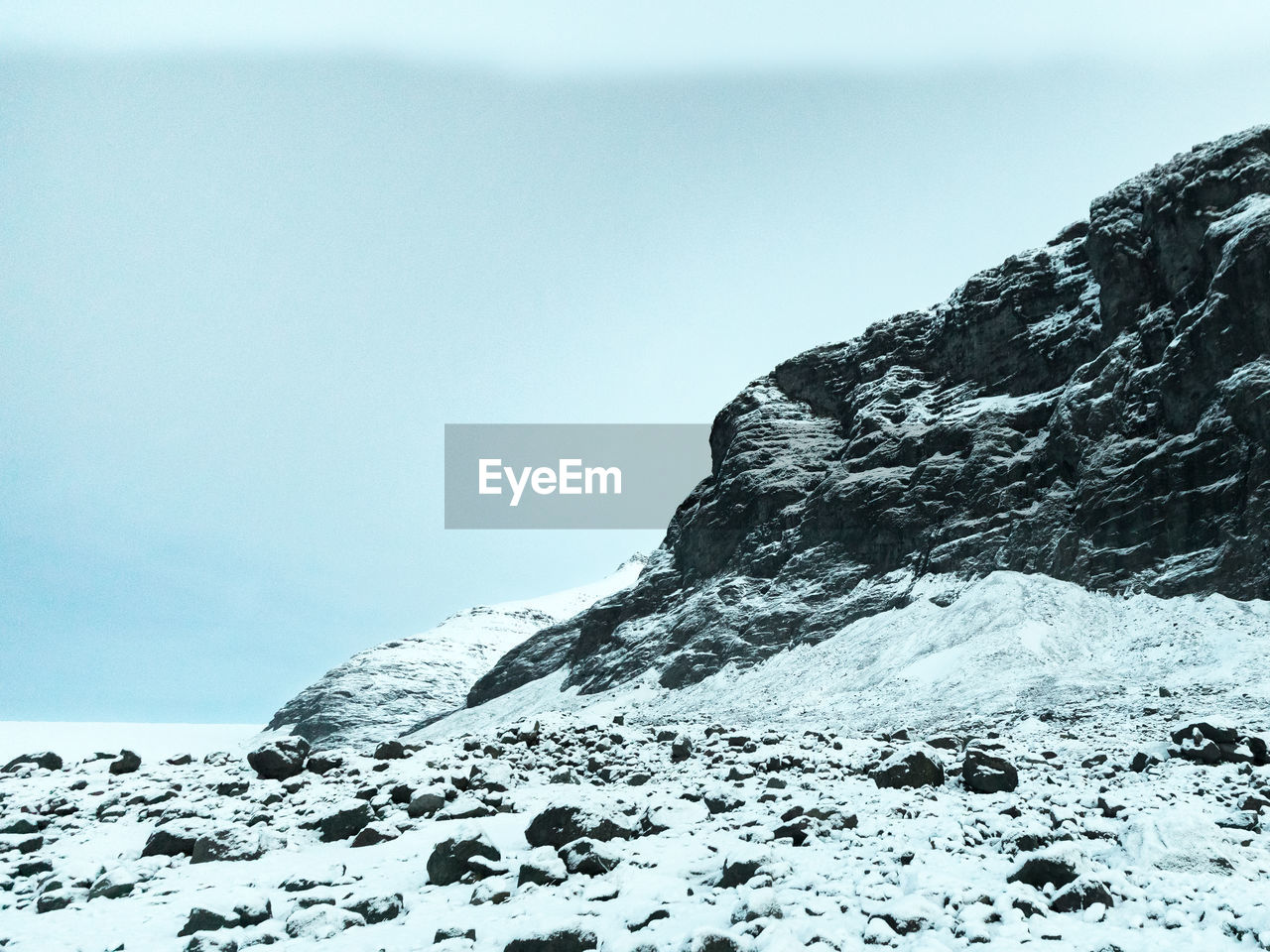 Scenic view of snowcapped mountain against sky,  at blue hour, in iceland