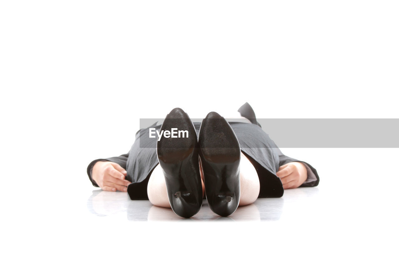 Businesswoman lying on white background