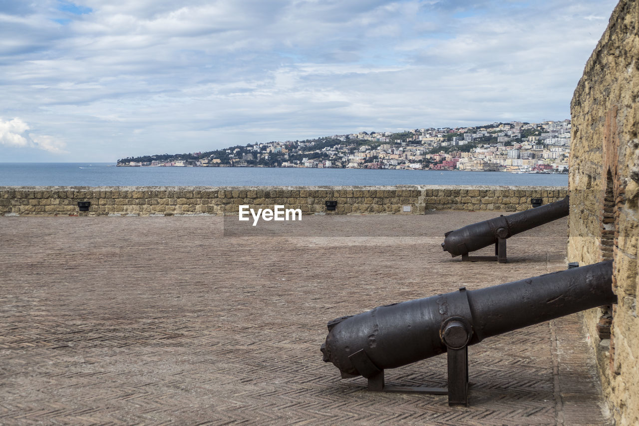 Guns in castle dell'ovo with gulf of napoli in background