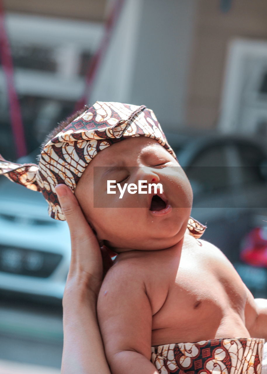 CLOSE-UP PORTRAIT OF A BABY GIRL