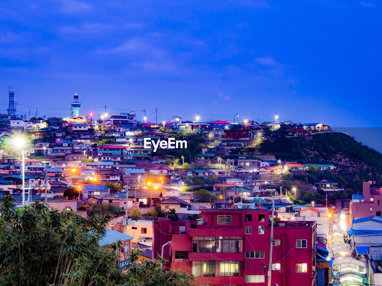 VIEW OF TOWN AGAINST BLUE SKY