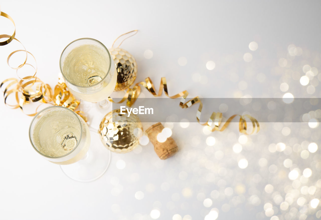 High angle view of wineglasses with christmas decorations on table