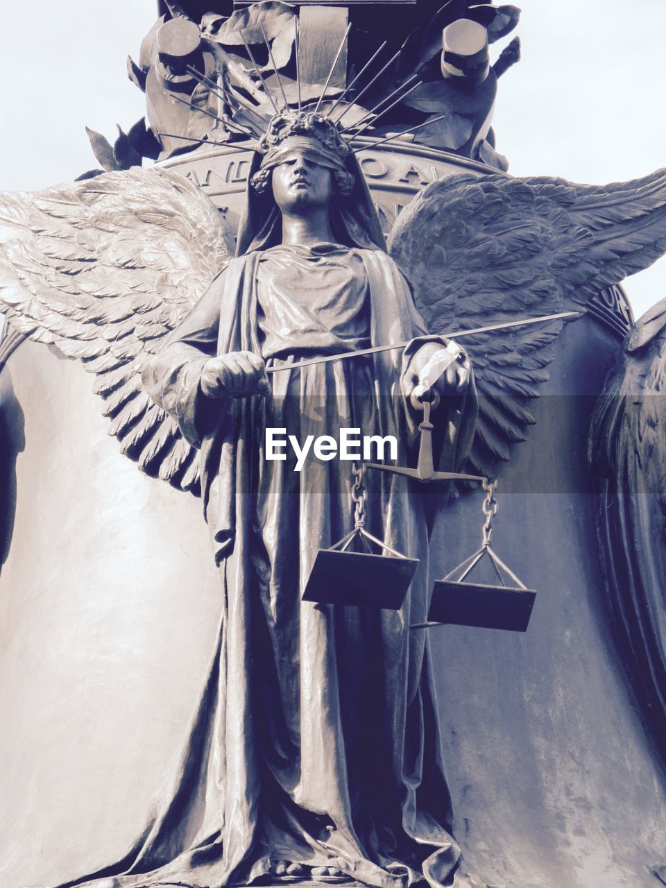 LOW ANGLE VIEW OF STATUES ON WALL