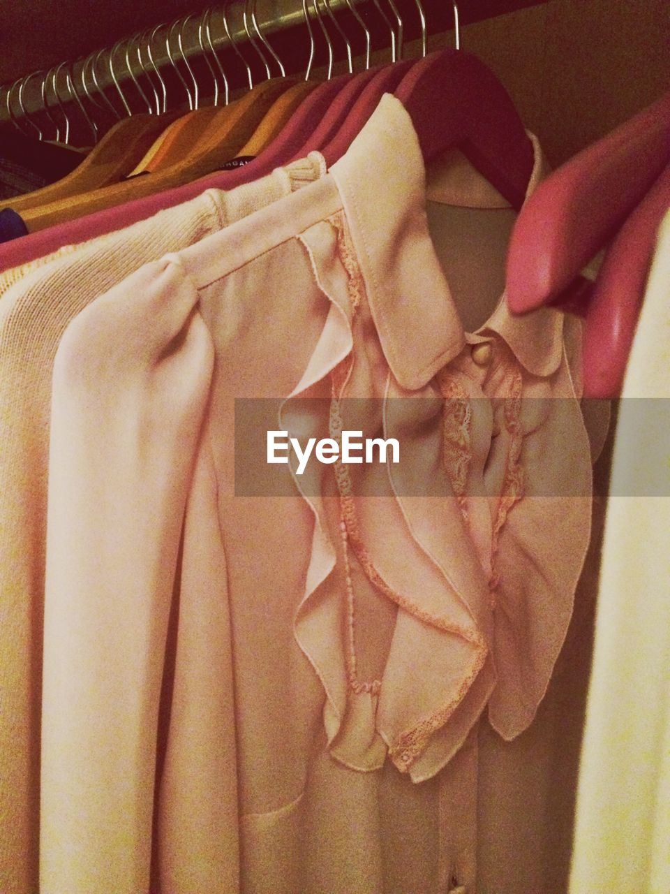 Close-up of clothes hanging in coathanger at home