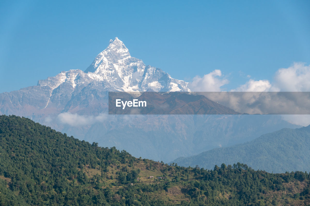 Scenic view of snowcapped mountains against sky