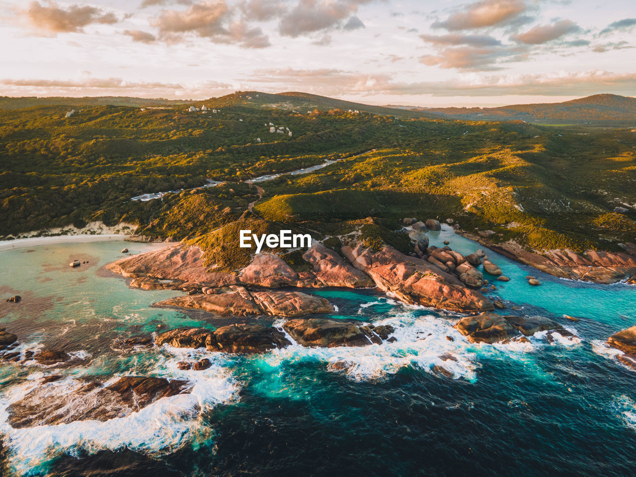 Aerial view of sea and mountains against sky