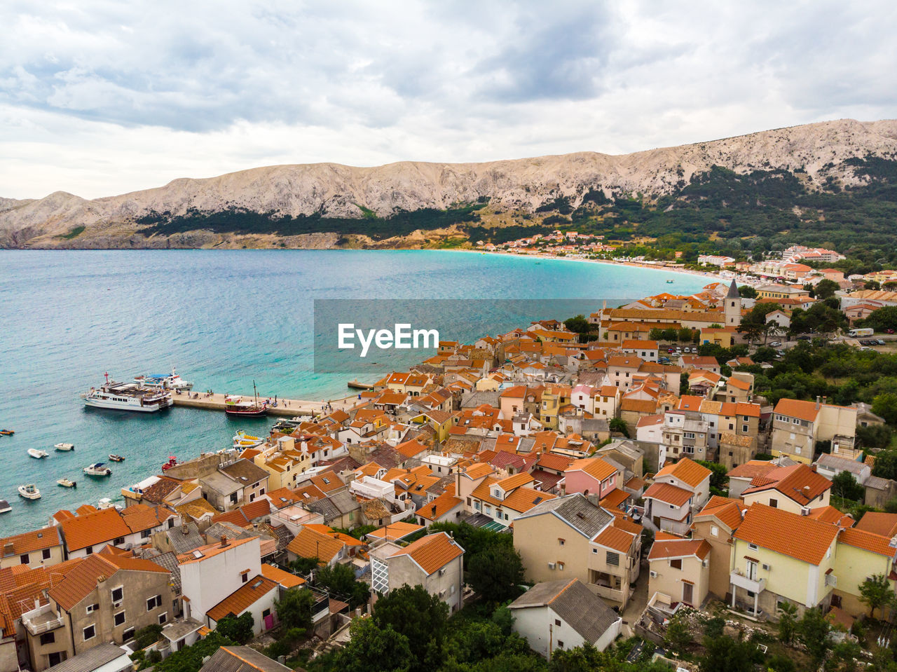 High angle view of townscape by sea