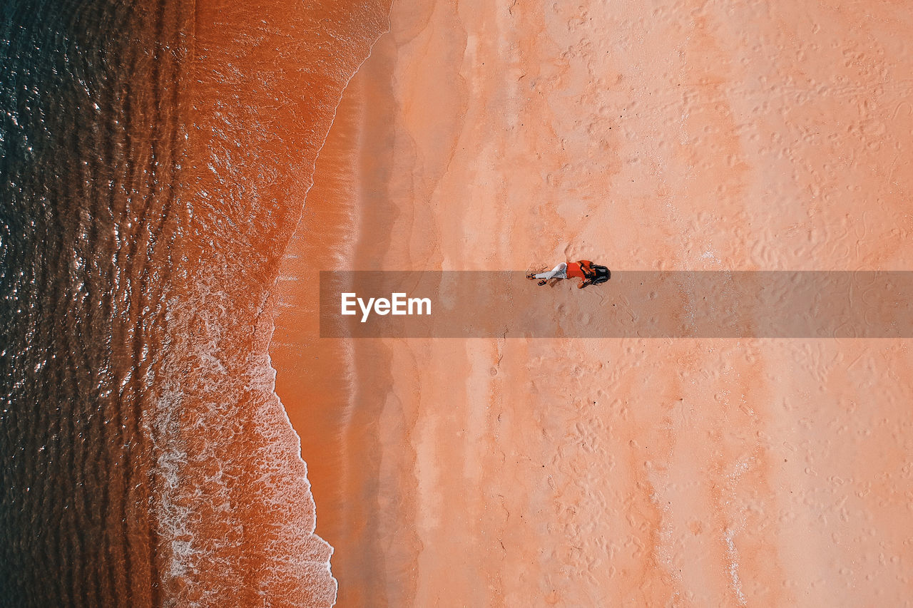 VIEW OF PEOPLE ON ROCK IN DESERT