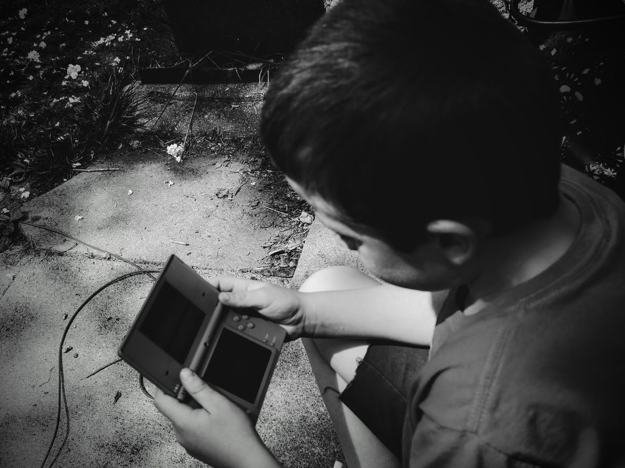 High angle view of boy playing video game