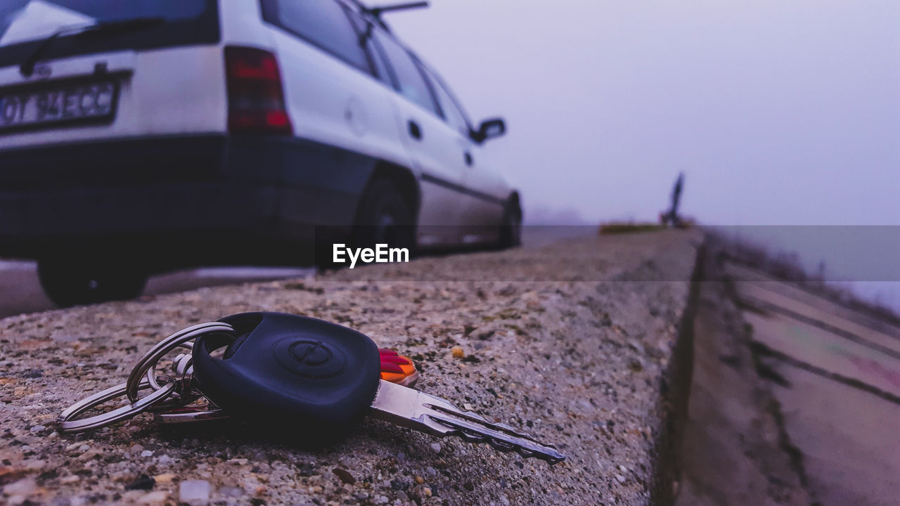 CLOSE-UP OF TOY CAR ON ROAD