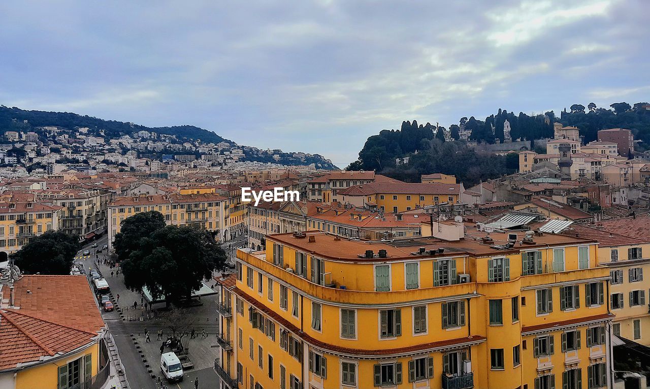 high angle view of buildings in town against sky