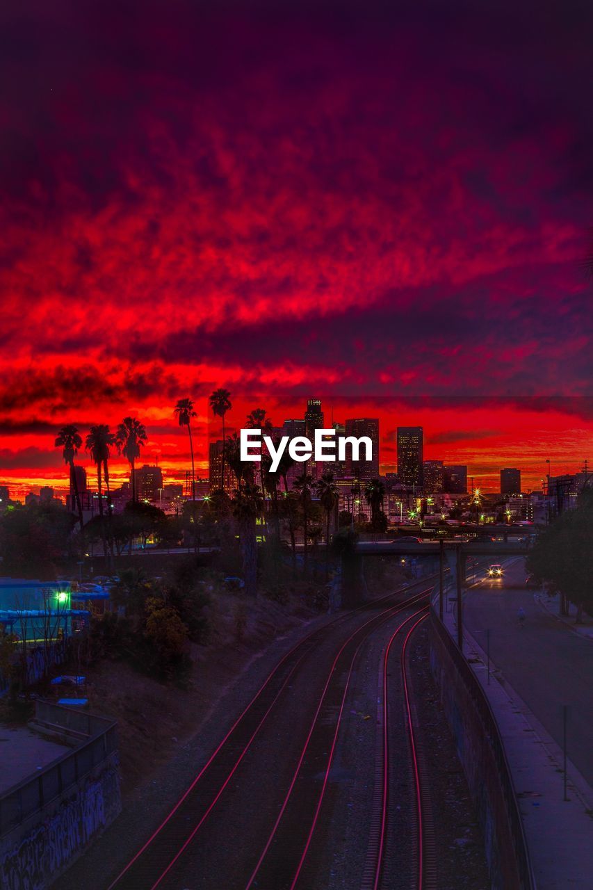 High angle view of railroad tracks against sky during sunset