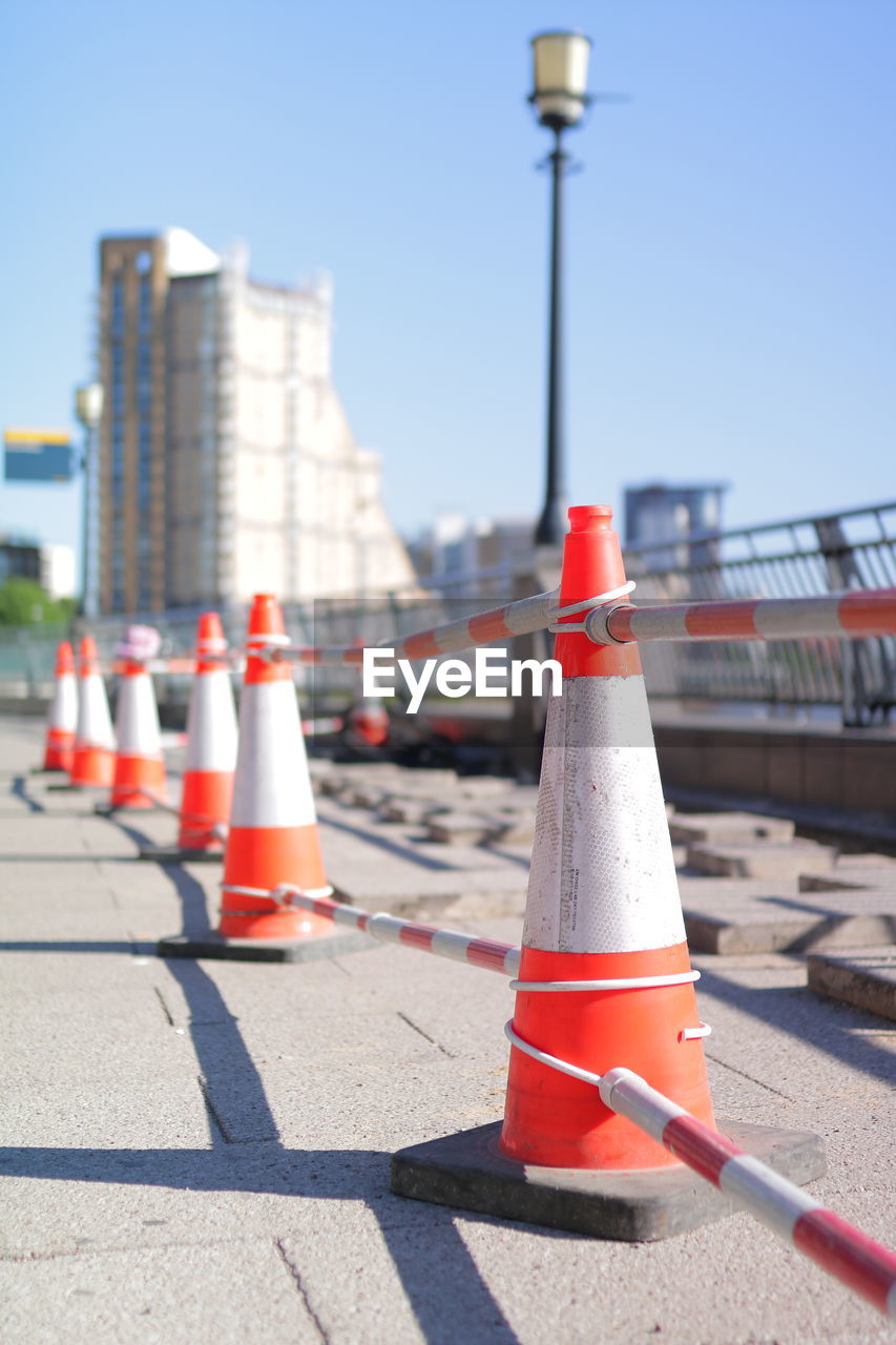 Traffic cones on road in city