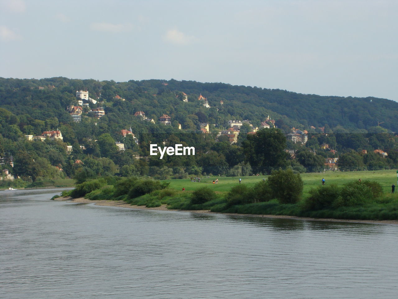 SCENIC VIEW OF RIVER BY TREE MOUNTAIN AGAINST SKY