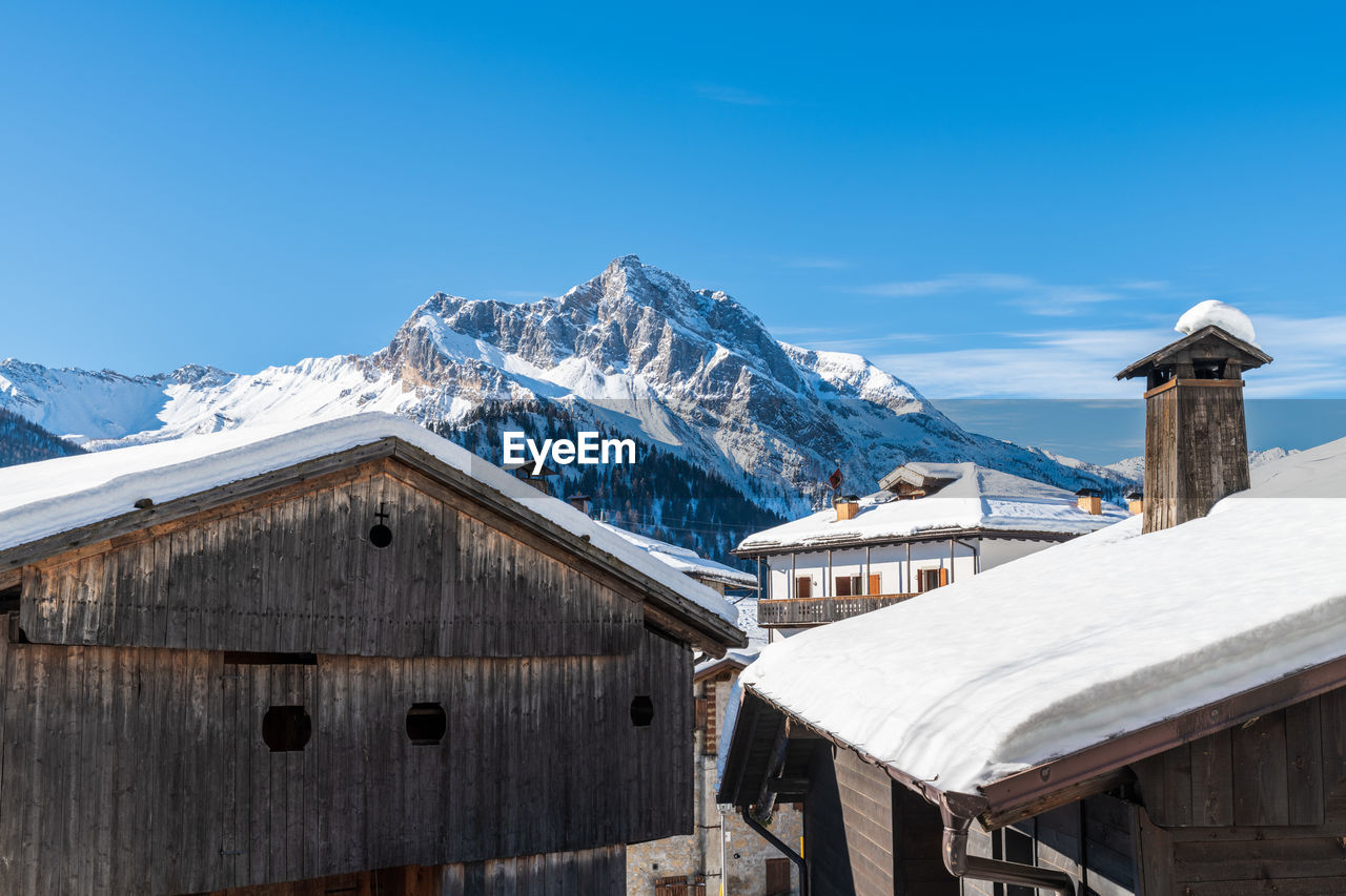 Winter magic. the ancient wooden houses of sauris di sopra. italy