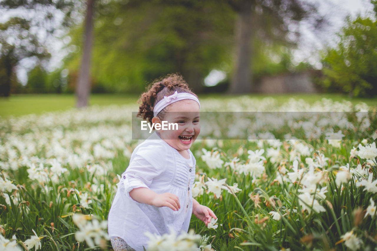 Portrait of happy girl in a meadow