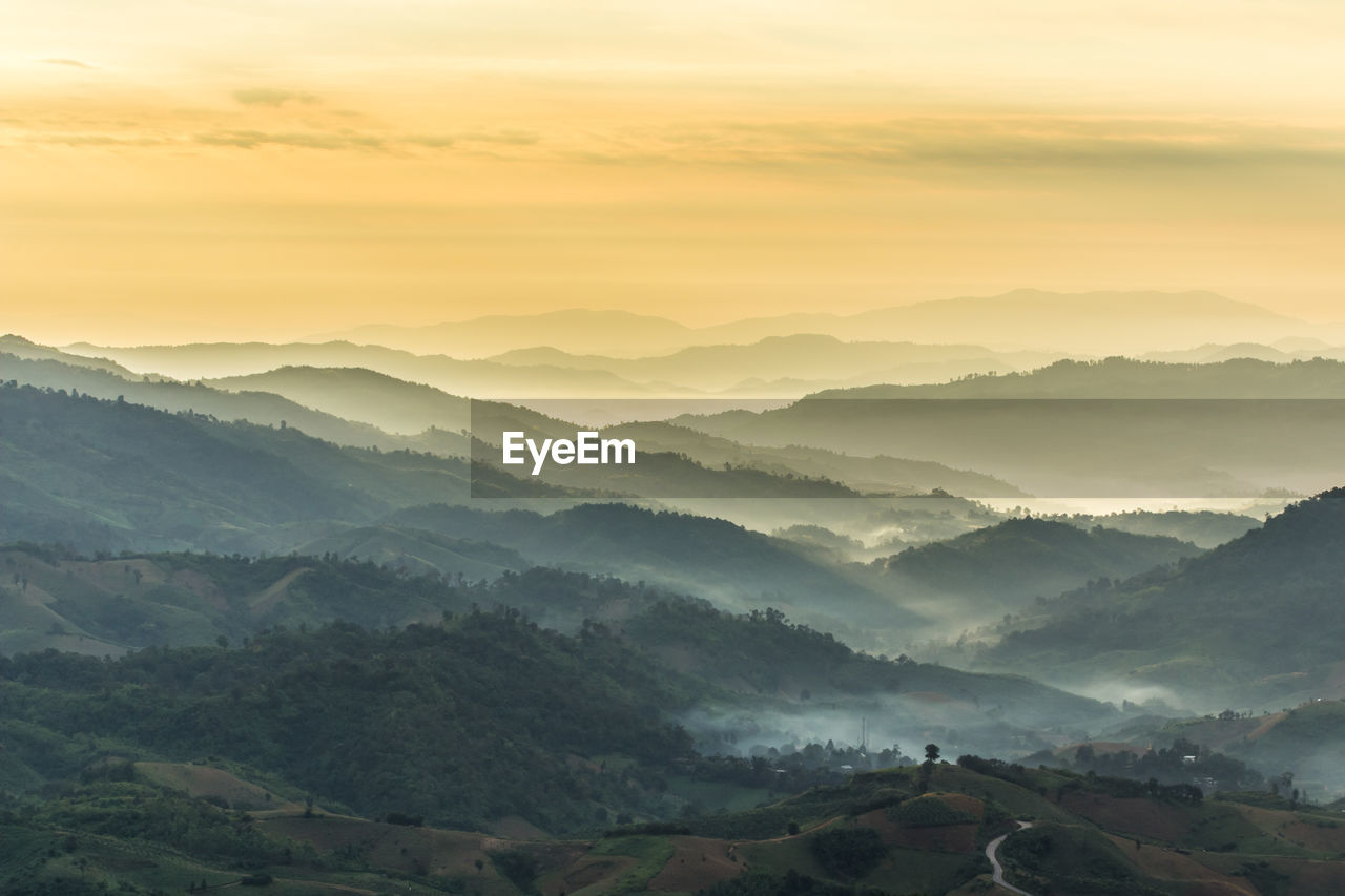 Scenic view of mountains against sky during sunset